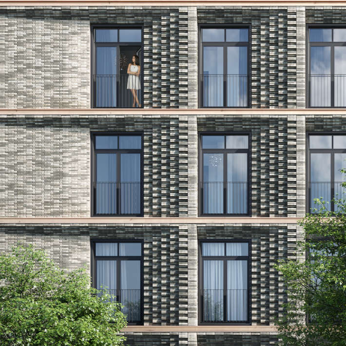 Кирпичное оформление фасада жилого комплекса Медный 3.14